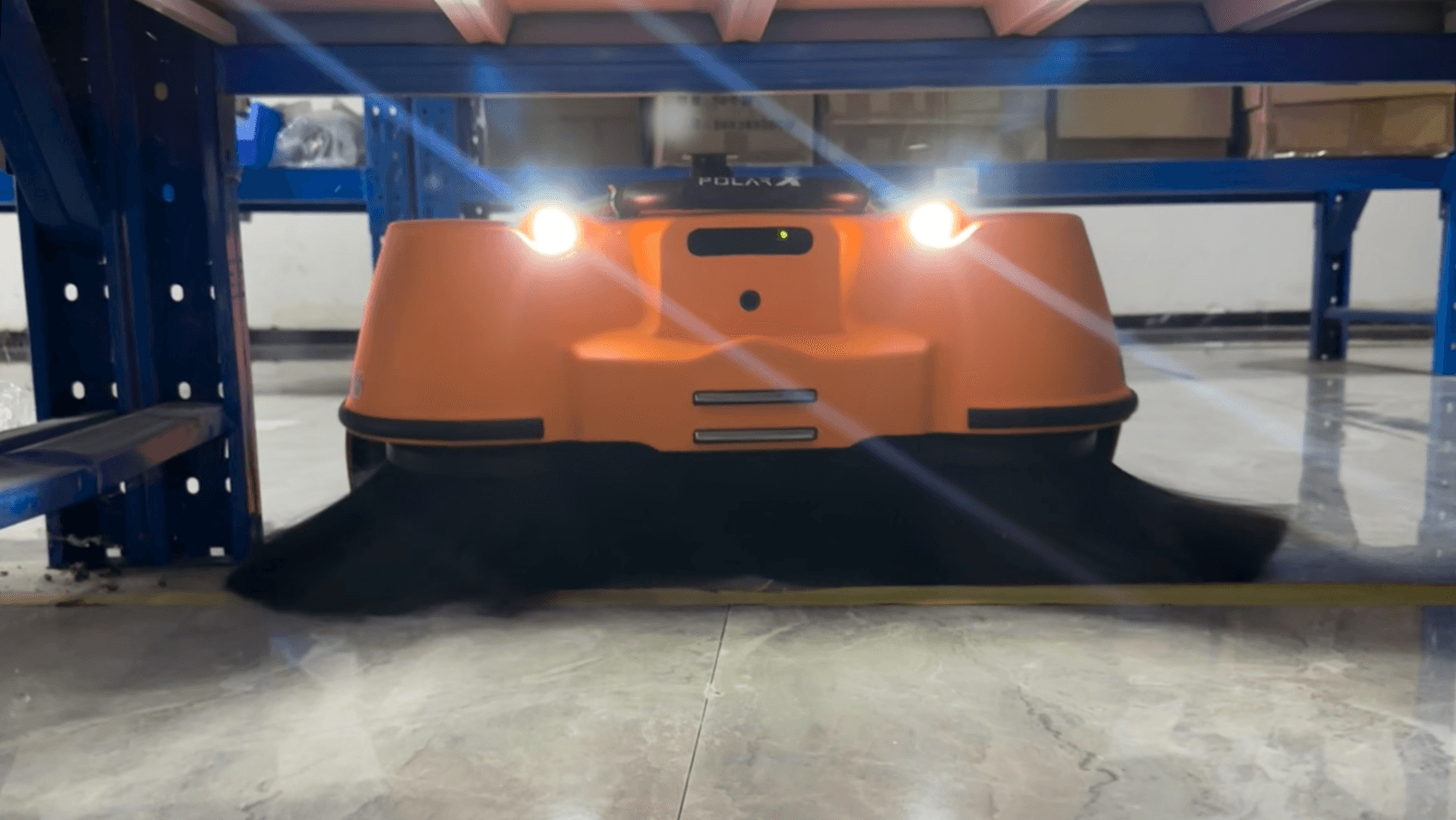 PolarX Star50 sweeping beneath industrial shelving